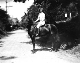 Miss Dorothy Lull [on horse], for Sun Social