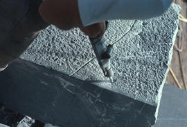 Stone tools - Close-up of sculptor with drill showing the break-off marking