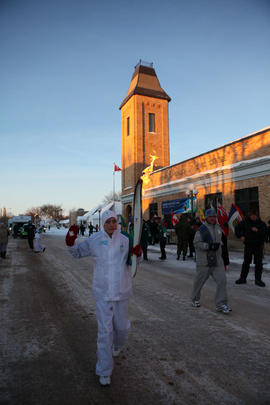 Day 72 Torchbearer 12 Brandon Masson carries the flame in Virden, Manitoba