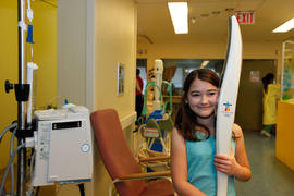 Day 52 Emily Jarvine holds the Olympic Torch at Children's Hospital in Hamilton, Ontario