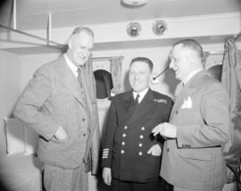 [Capt. D.C. Wallace, Clarence Wallace and another man on board the C.N.R. boat the "Canadian...