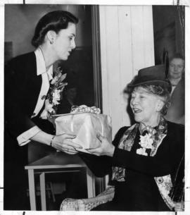 Viola Johnston presents gift to Annie B. Jamieson