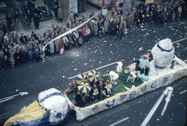 43rd Grey Cup Parade, on Granville Street, UBC Football float, spectators and ticker tape