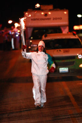 Day 66 Torchbearer 56 Judy Nagy carries the flame in Thunder Bay, Ontario.