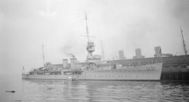 [British warship at dock]