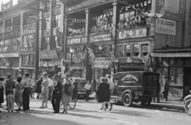 [Crowds in street in Chinatown during VJ Day celebrations]