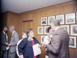 Alderperson Libby Davies speaking to Alderperson Don Bellamy at reception