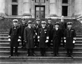 Official Japanese delegation posed on stairs of Court House with Mayor Louis D. Taylor and George...