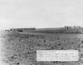 Bunk house, cook house and temporary houses showing west road leading to factory