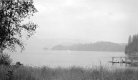 Deep Cove, circa 1912.  Jug Island in distance. Float at foot Deep Cove Rd