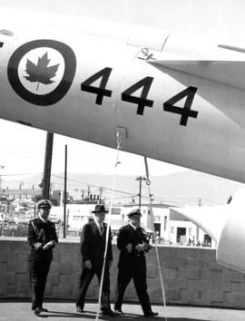 Lieutenant Governor G.R. Pearkes with R.C.N. officers at Armed Forces of Canada exhibit on P.N.E....