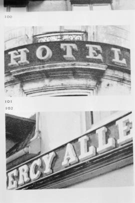 [Detail of business signs - image of printed photograph, 1 of 3]