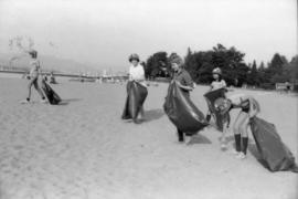 Girl Guides picking up litter from beach