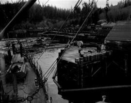 [Boat approaching] Pacific Mills [dock on the] Queen Charlotte Islands