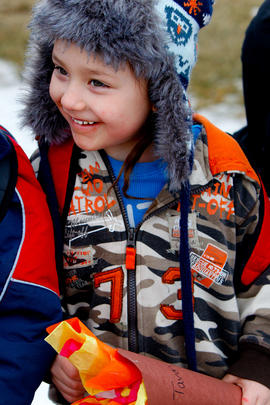 Day 78 Young boy smiles as he sees the flame for the first time as it enters Hobbema's Flame Bles...