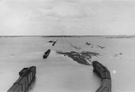 Trains and flooded railway tracks