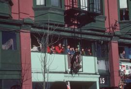 Spectators viewing the Chinese New Year parade from the second storey of 15 East Pender Street