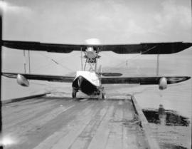 [Vickers Vedette Amphibian climbing ramp from water]