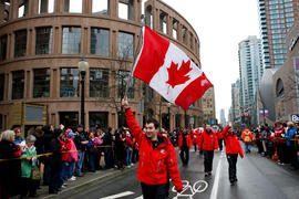 Day 106 Coca-Cola crew runs past the Vancouver Public Library in Vancouver, British Columbia.