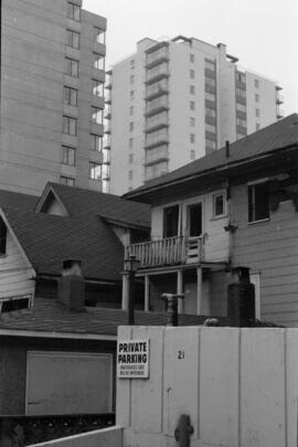 [View of high rise apartments from an alley, 3 of 6]