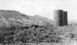 View of IMPOCO railway siding, storage tanks, at Asher