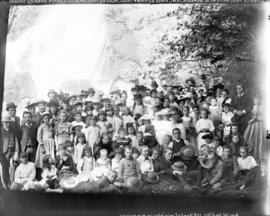 [Group of men, women and children from the First Baptist Church assembled for picnic at Granite F...