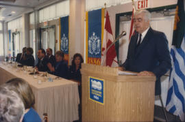 Patrick Reid speaking from podium