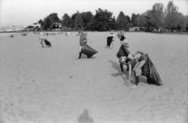 Girl Guides picking up litter from beach