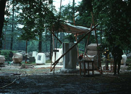 Sculpture housed in a wooden shelter