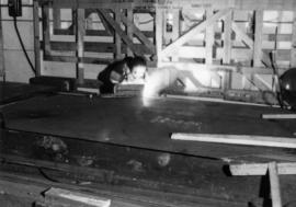 War work: deckhouse construction for Burrard Drydock, cutting steel plate