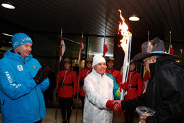 Day 73 Torchbearer 1 Gerald Walsh shakes hands with Elder (R) after a Flame Blessing at Regina's ...