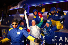 Day 42 Torchbearer 167 Bob Eyton-Jones poses for a photo with RBC before his run in Montréal, Que...