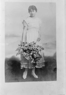 Girl with basket of flowers