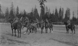 Men mounted on horses bareback and holding long poles, possibly jousters