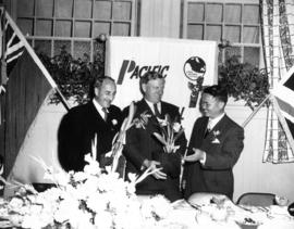 P.N.E. President G.M. Ferguson posing with dignitaries at horticultural exhibit