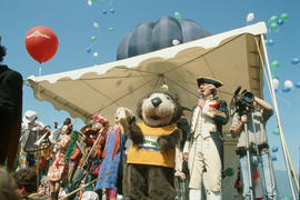 Tillicum, clowns and actor dressed as Captain George Vancouver on stage at Stanley Park