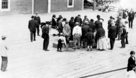 [A group of people on a dock]