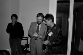 Poet Fred Wah with Elwin Yuen at the Saltwater City exhibit reading at the Chinese Cultural Centre