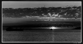 Two ships anchored in English Bay at sunset