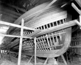 [Boat under construction by Japanese men]