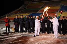 Day 72 Torchbearer 87 Roger L. Brown (R) is passing the flame to torchbearer 88 Callie Morris (L)...