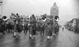 [Shriner band playing in a parade along Burrard Street]