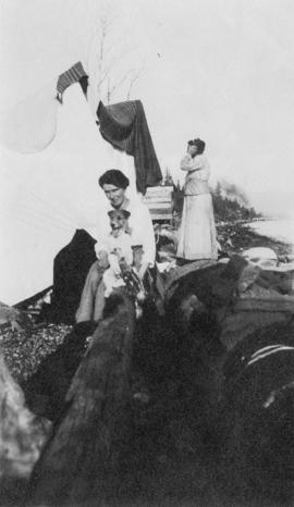 Aldyen Hendry and her long-haired terrier at the beach