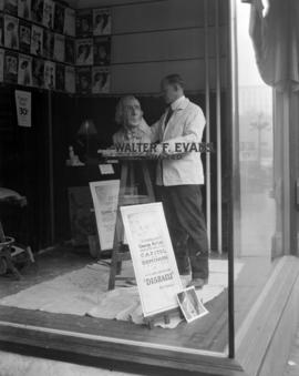 [George] Paterson [sculpting bust of George Arliss in the window] of Walter F. Evans Ltd. [657 Gr...