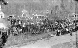 [Bishop Durieu, Father Le Jeune, and the Very Rev. J.M. Fayard with a large group of Native India...