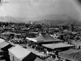 View of amusement rides and tents in P.N.E. Gayway