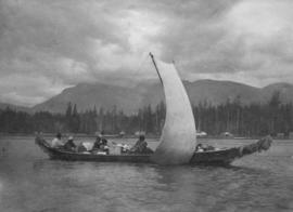 First Nations in a dug-out canoe with sail