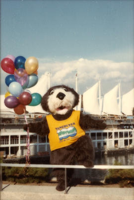 Tillicum holding balloons in front of Canada Place