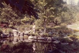 Woman standing in rock garden at the Panabode