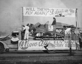 [Boeing workers on top of parade float truck]